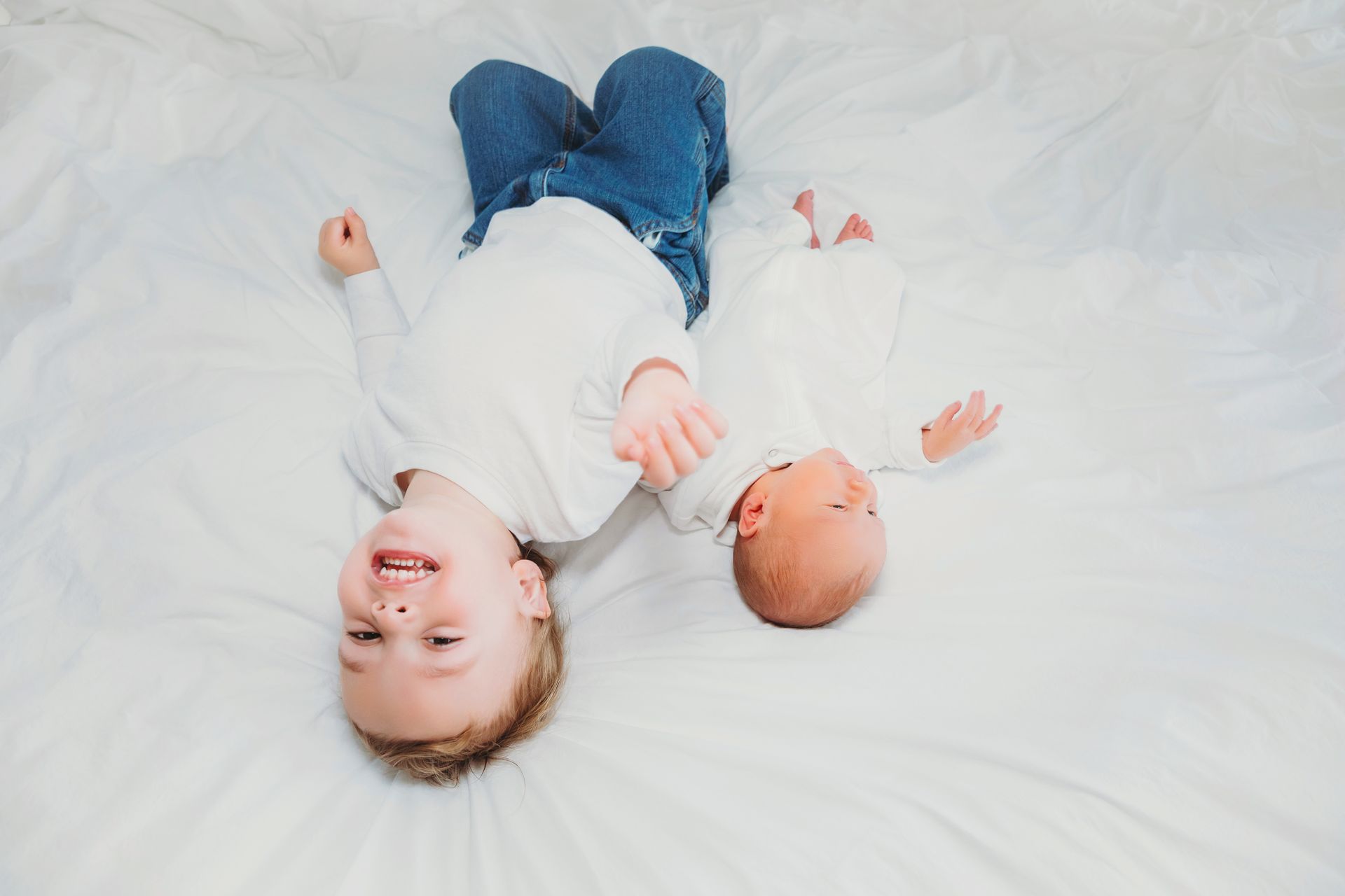 Mother’s Day portrait session in a vibrant red poppy field with natural light