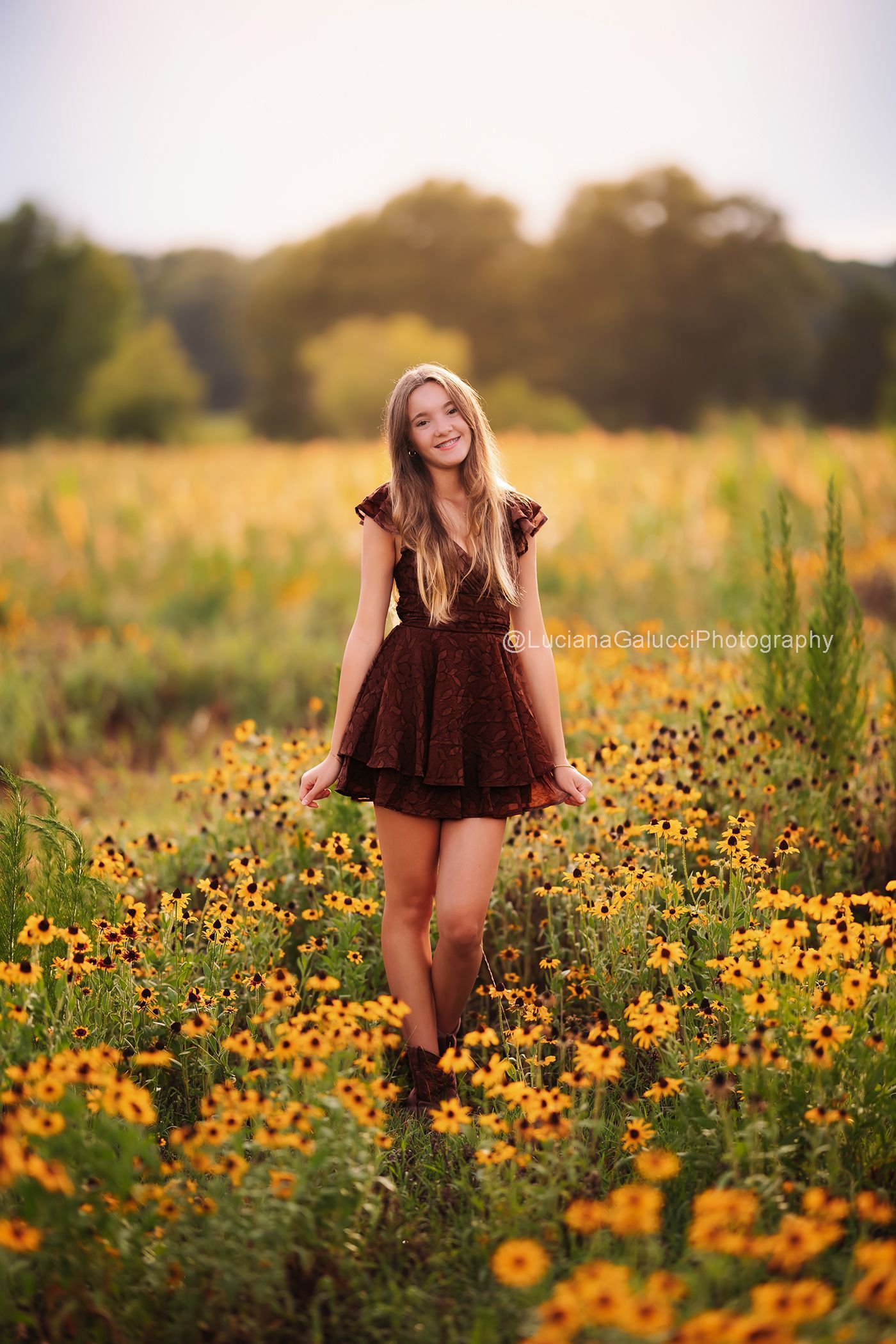 Teen candid  portrait surrounded by wildflowers at sunset in Raleigh, North Carolina.