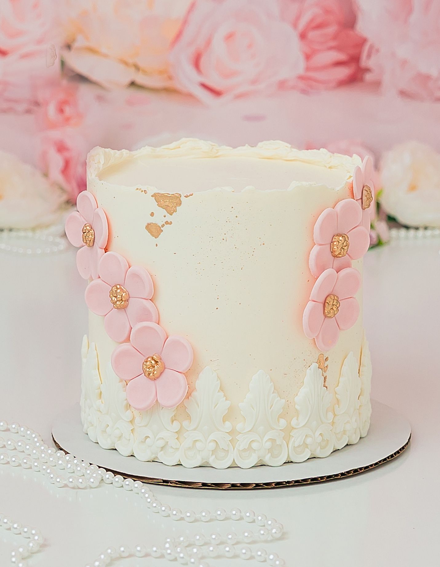 floral cake theme for a cake smash session in studio - Cary NC