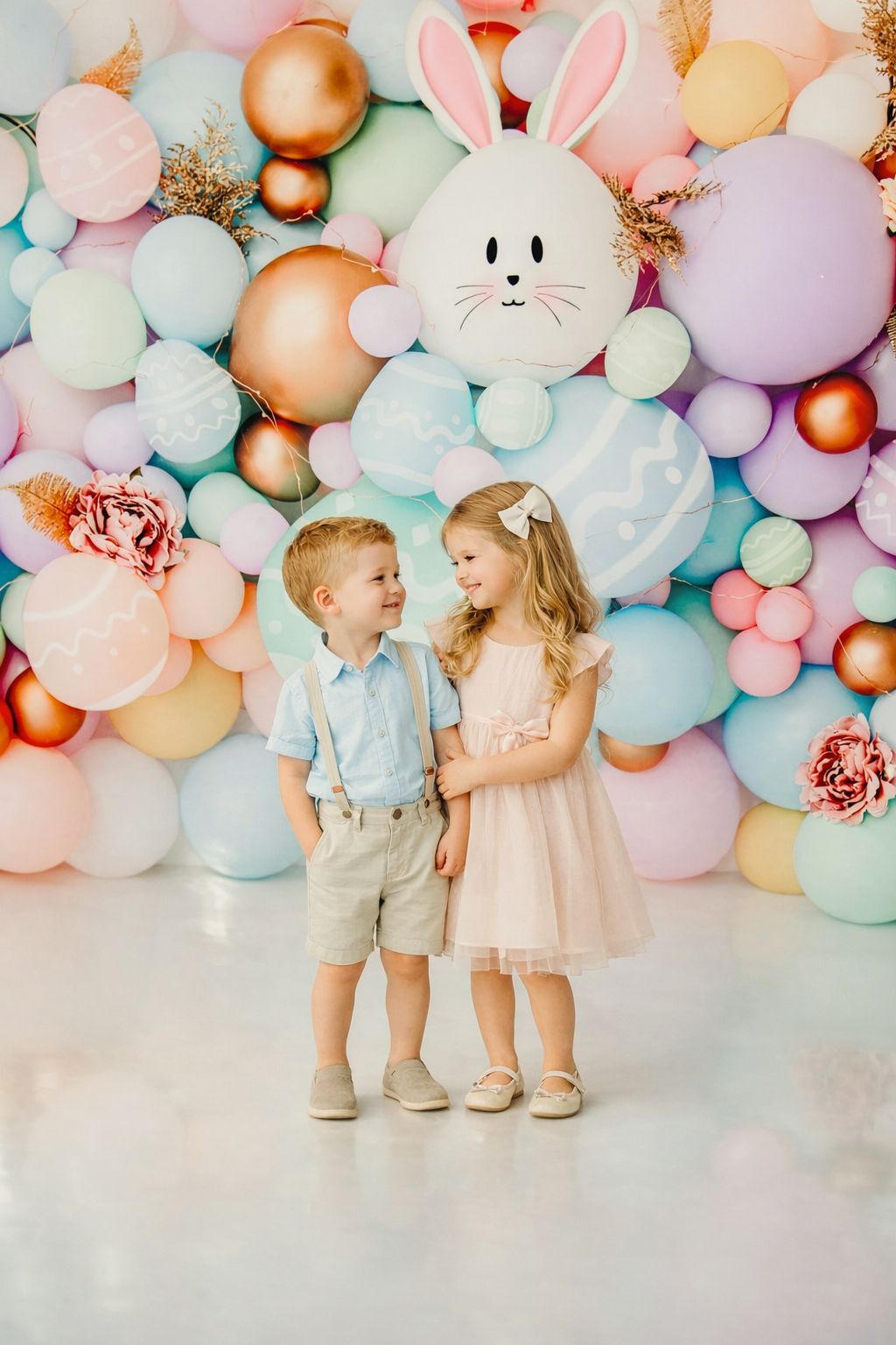 Brother and sister during a pastel Easter mini session near Raleigh and Cary, NC in a colorful studio setup.