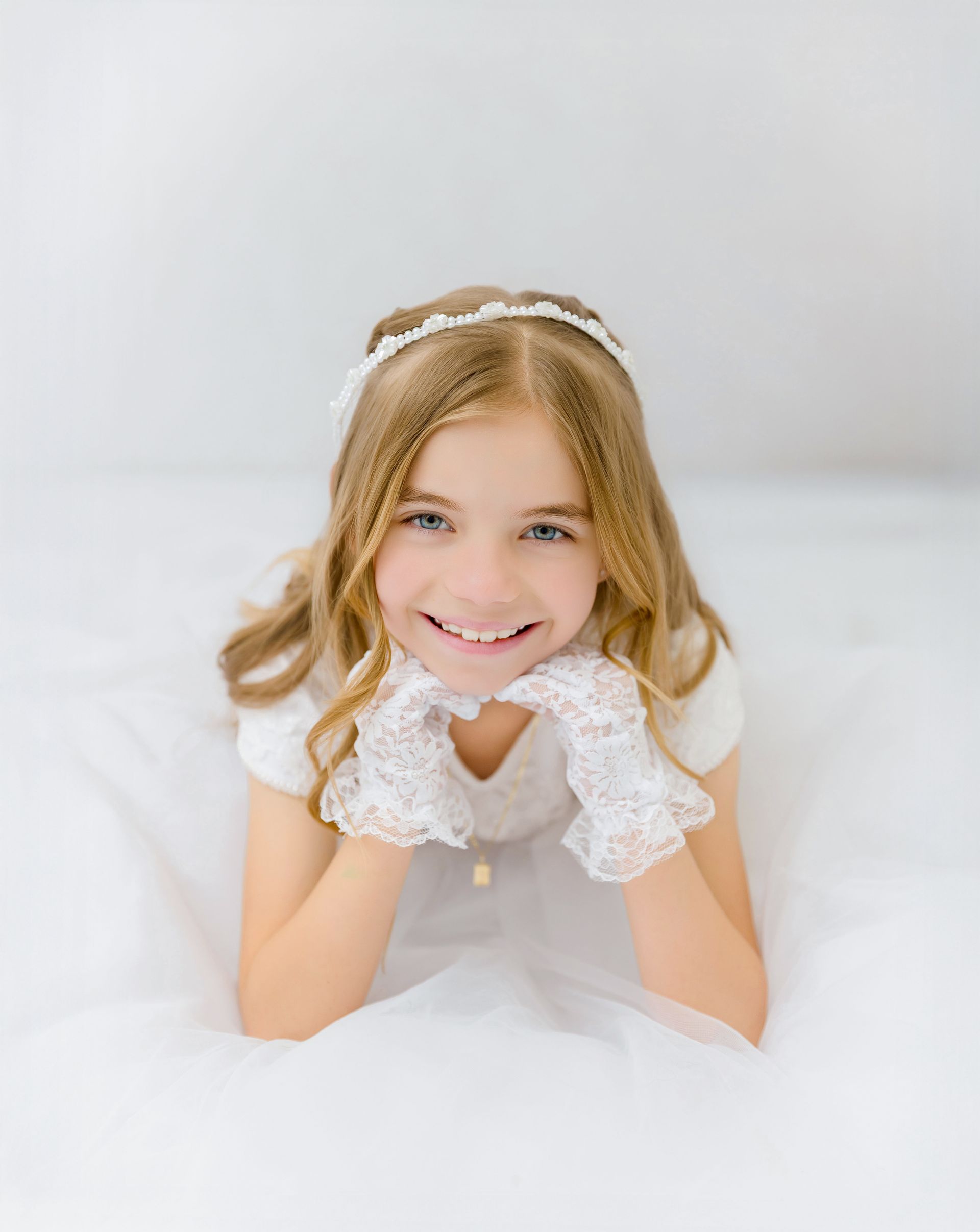 catholic first communion portraits girl white dress raleigh photographer