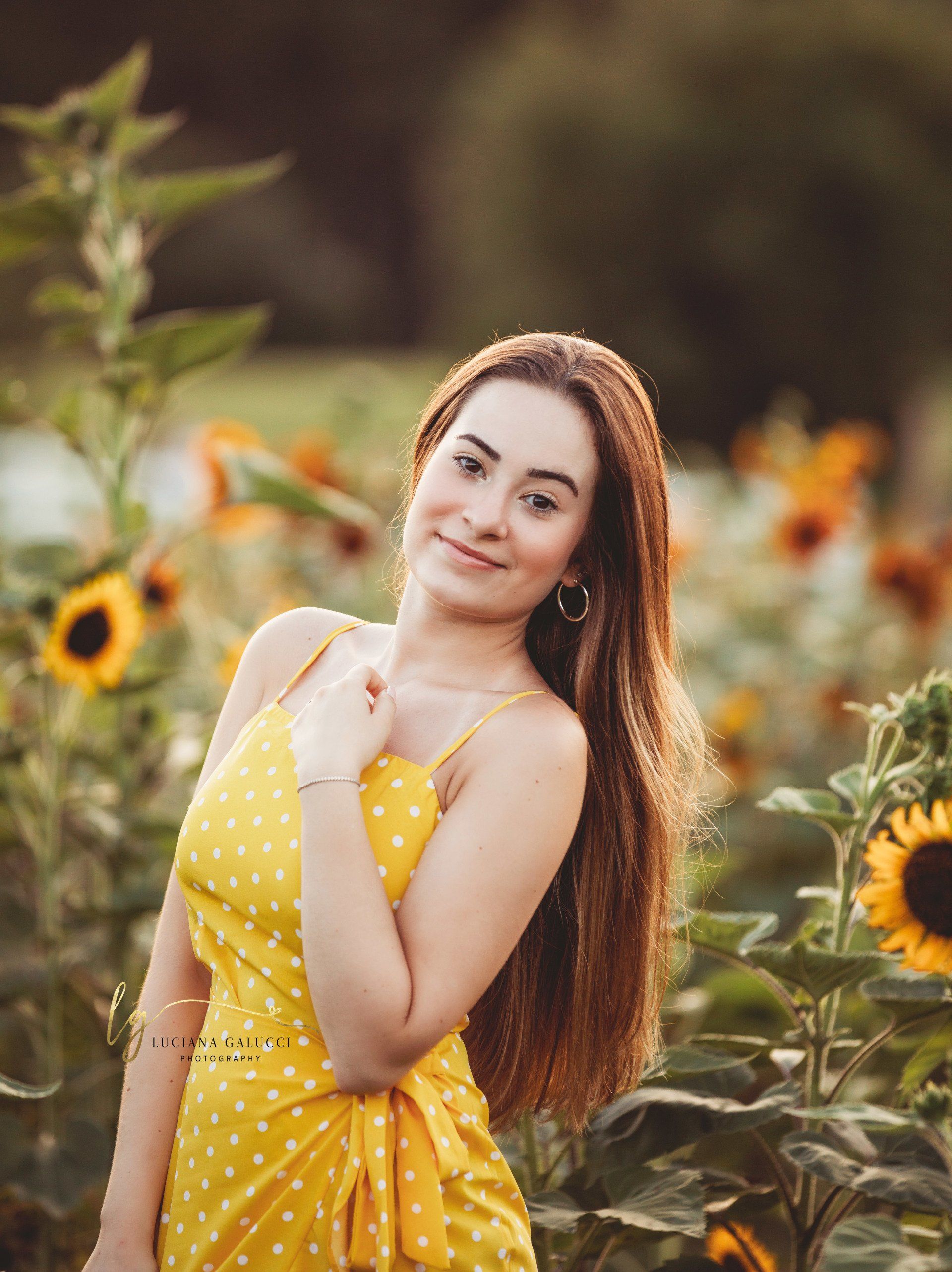 Golden hour senior portrait session in a sunflower field at Dix Park in Raleigh, North Carolina
