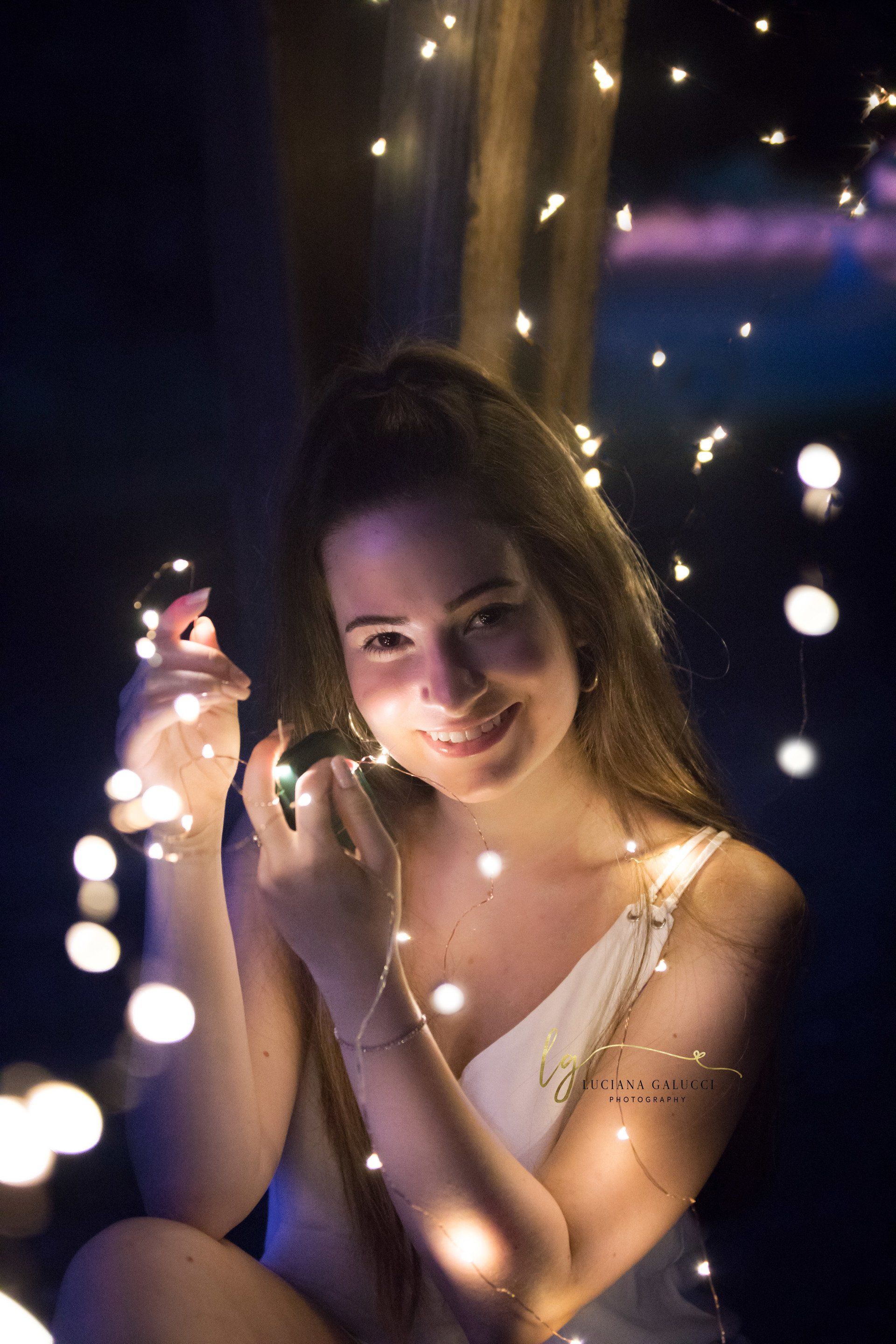 Golden hour senior portrait session in a sunflower field at Dix Park in Raleigh, North Carolina
