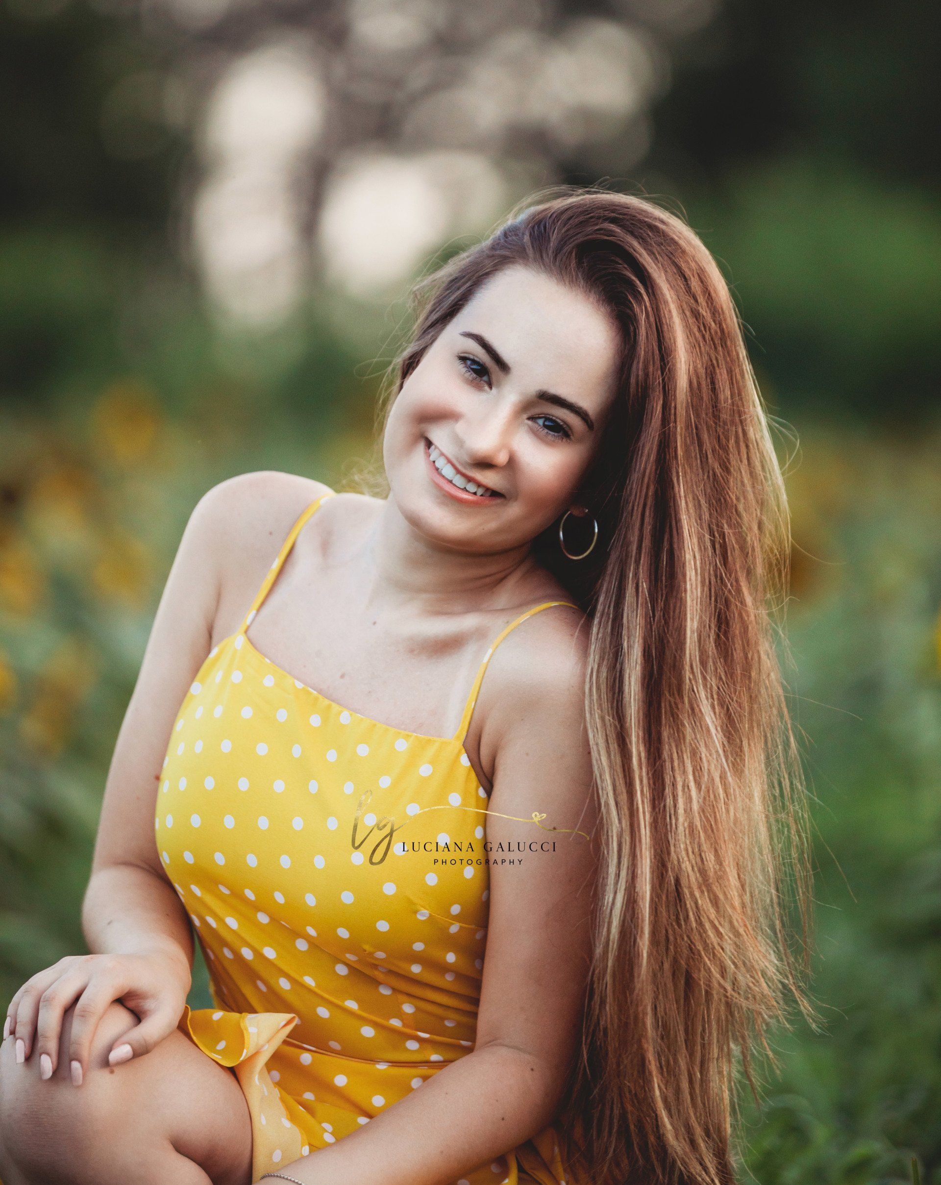 Golden hour senior portrait session in a sunflower field at Dix Park in Raleigh, North Carolina
