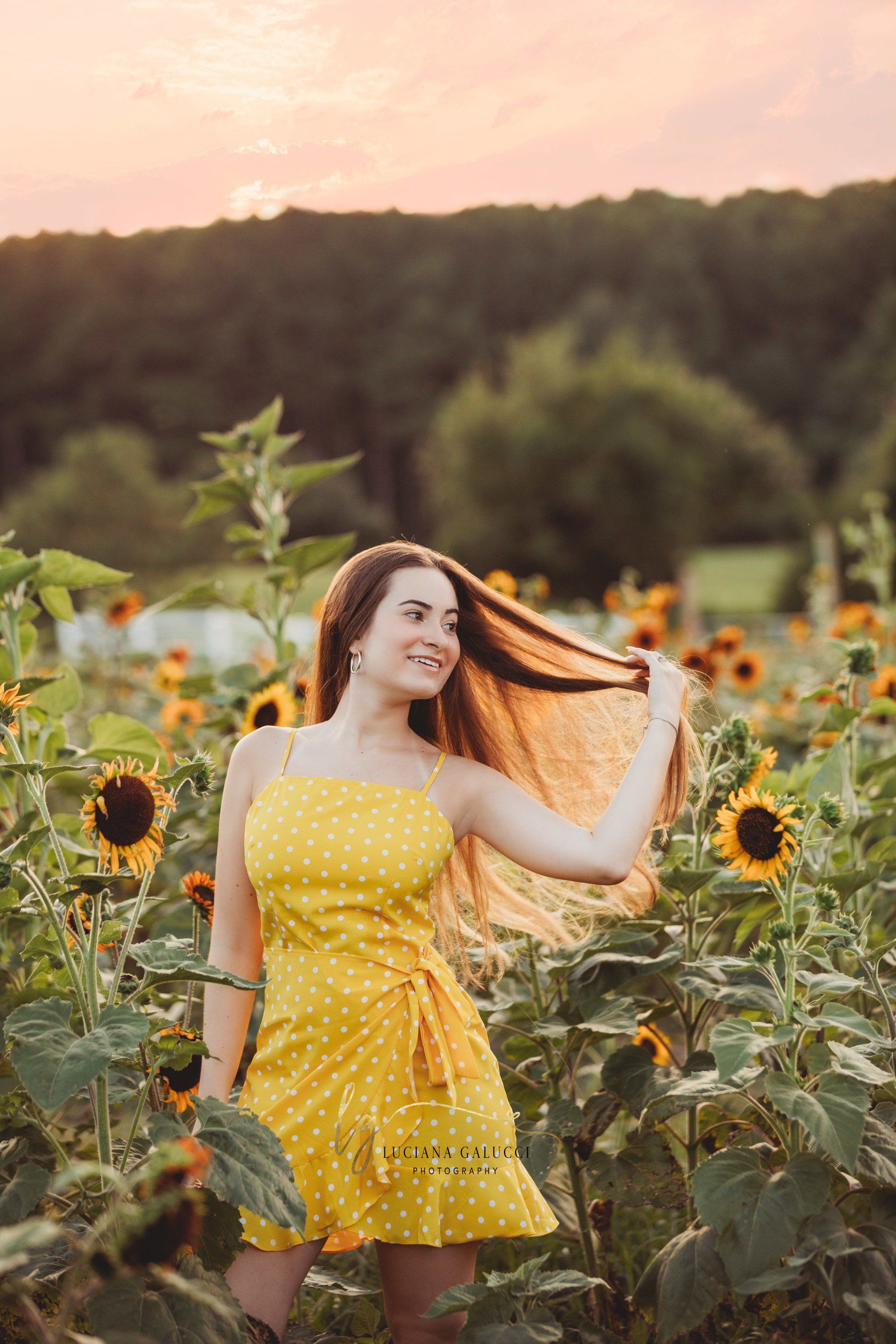 Golden hour senior portrait session in a sunflower field at Dix Park in Raleigh, North Carolina
