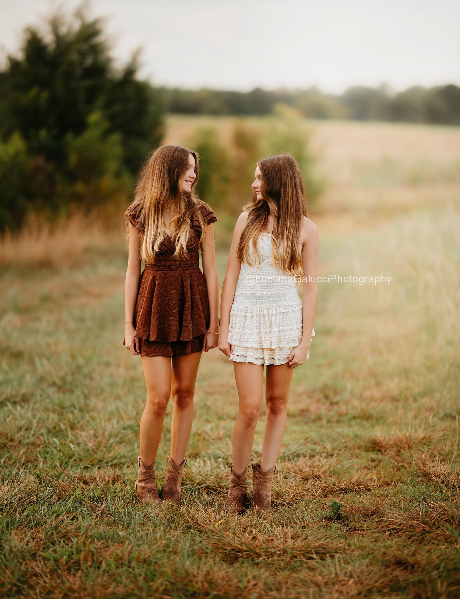 Twins Teenager sisters photoshoot at a golden tall  grass field
 in Raleigh NC