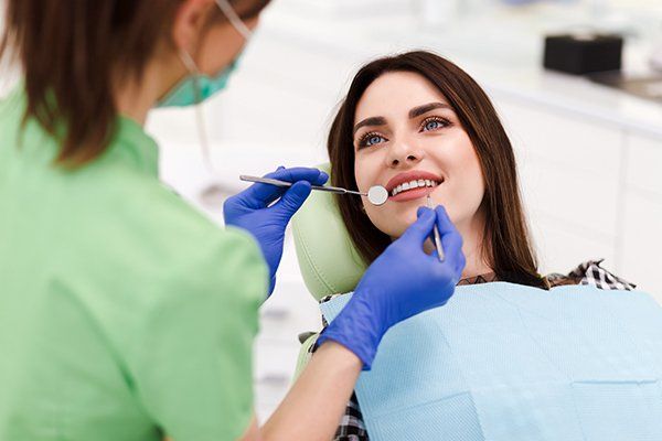 Beautiful Woman Doing Tooth Examination in the Dental Office — Hurricane, WV — Kendrick Dental Care