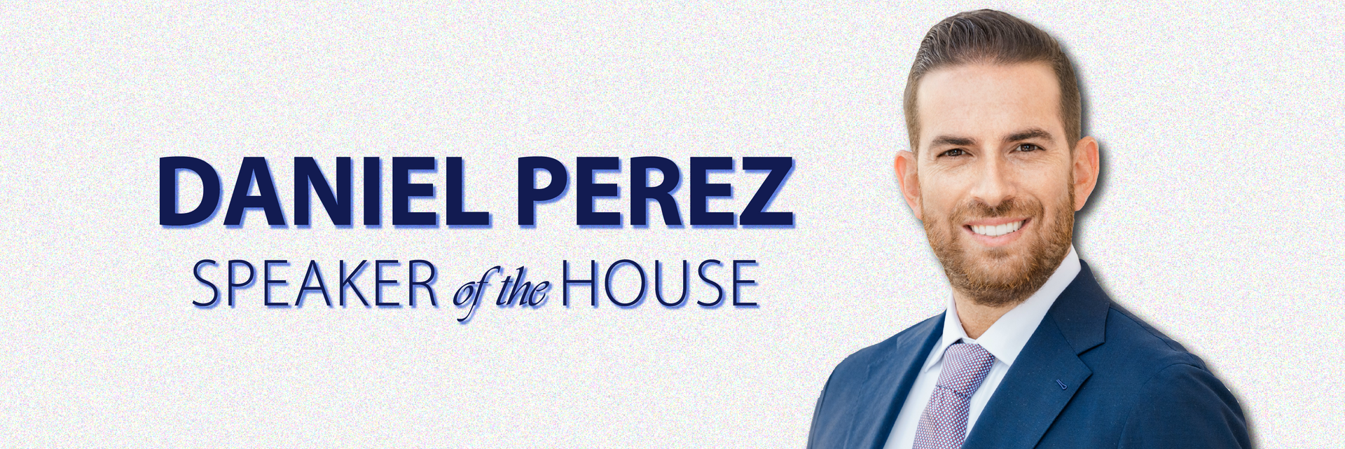 Speaker Daniel Perez is standing in front of a sign that says daniel perez speaker of the house.