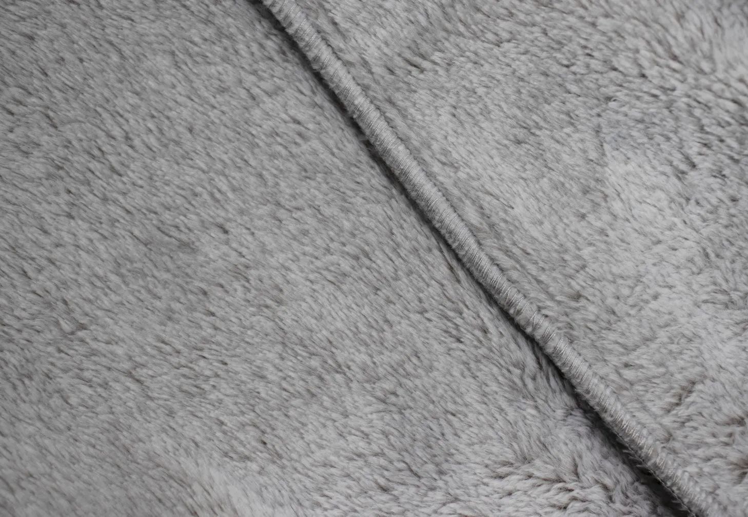 A close up of a piece of grey fur.