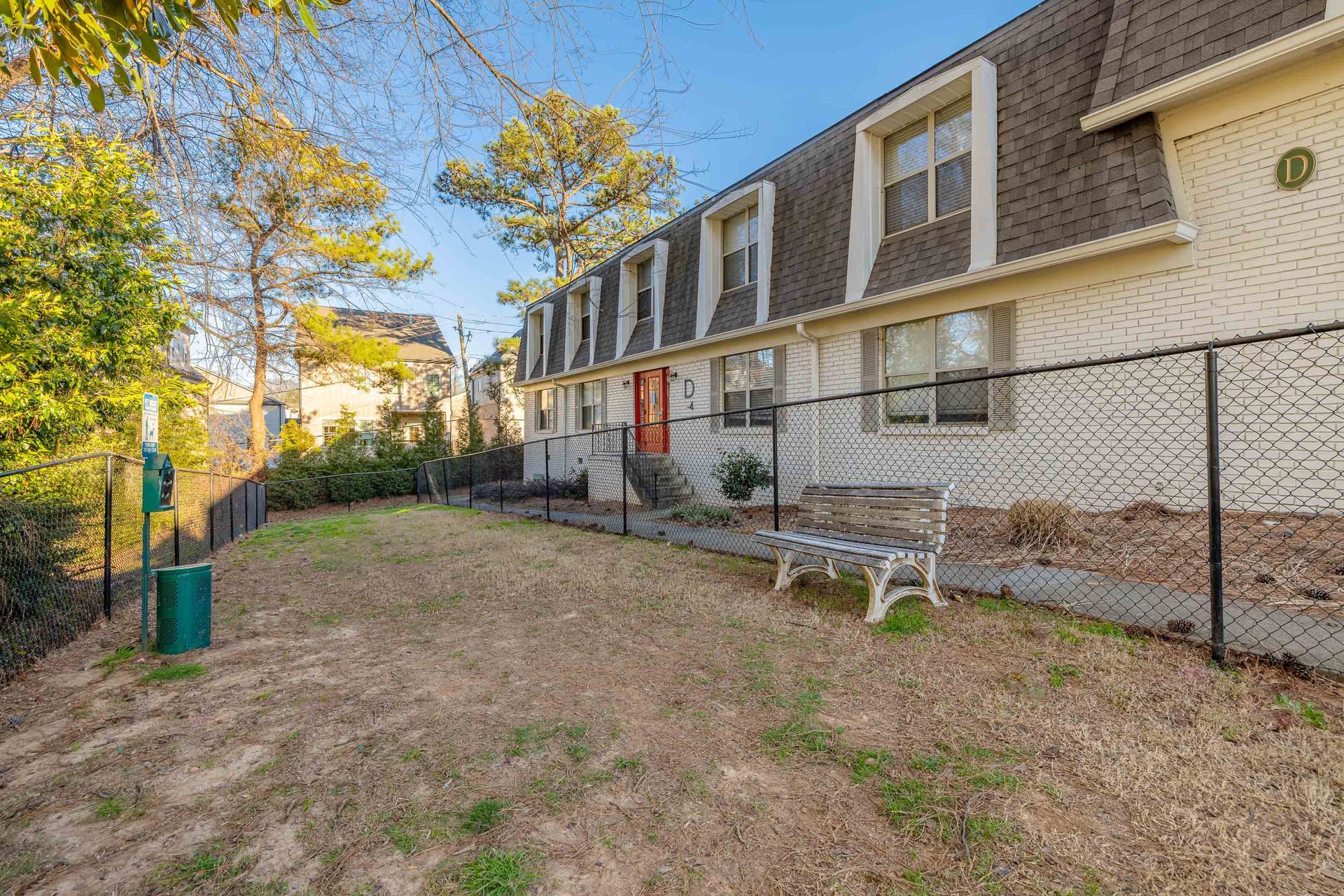 Apartment buildings, pet area, and green space at Westside Court in Atlanta