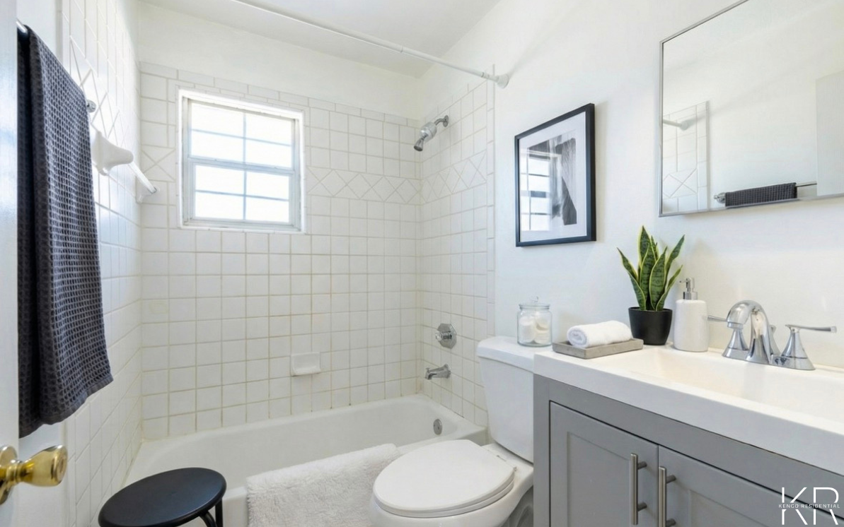 Bathroom with tiled shower at Peachtree Hills Court in Atlanta