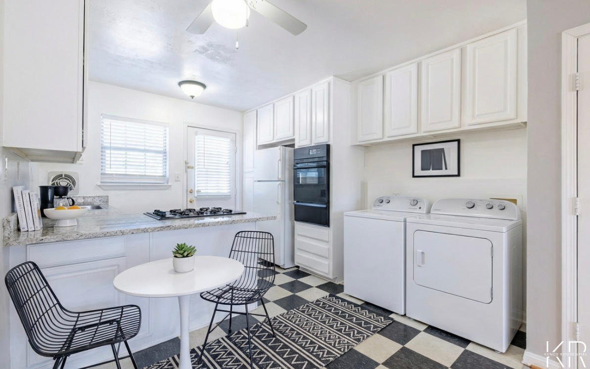Kitchen with in-unit laundry at Peachtree Hills Court apartment in Atlanta GA