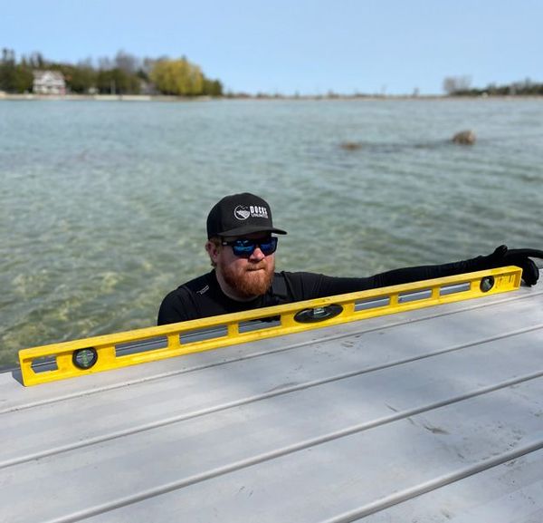 An aluminum dock overlooking clear waters: A prime example of how to keep your dock in top shape with Docks Unlimited's annual maintenance service.