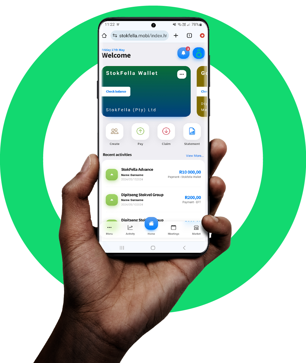 A hand is holding a cell phone in front of a green circle.