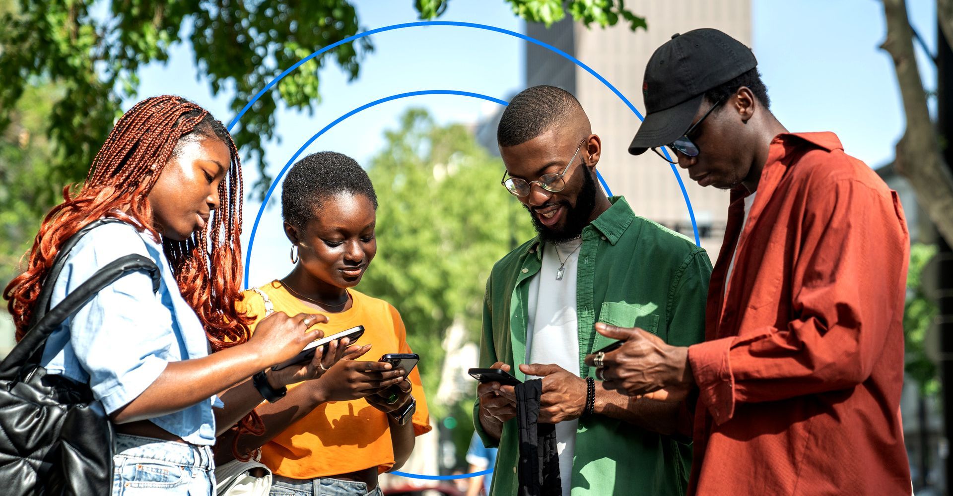 Group of young people looking at their mobile phones