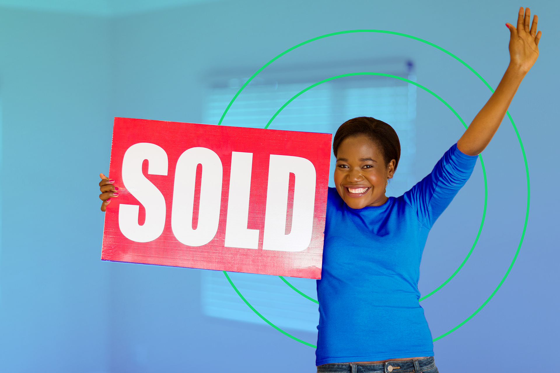 Excited women holding sold sign