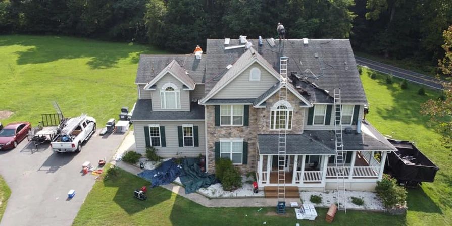 Repairing Roof — Fredericksburg, VA — John Mills JR Roofing Co. Repairing Roof — Fredericksburg, VA — John Mills JR Roofing Co.