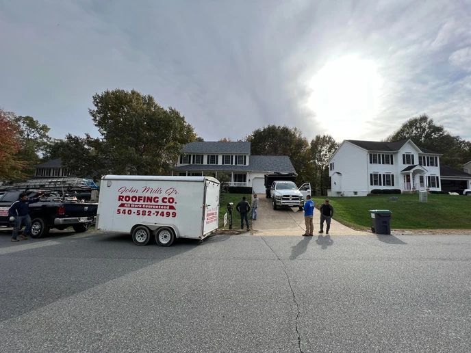 Men Infront Of Nice House — Fredericksburg, VA — John Mills JR Roofing Co.