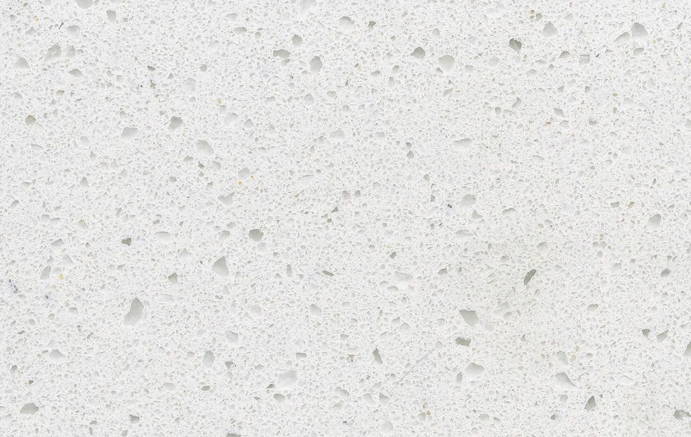 White quartz countertop with speckled patterns.