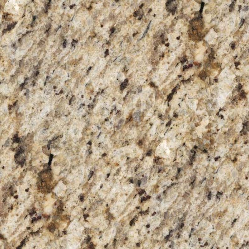 Close-up of granite countertop with a speckled pattern in shades of beige, tan, and dark brown.
