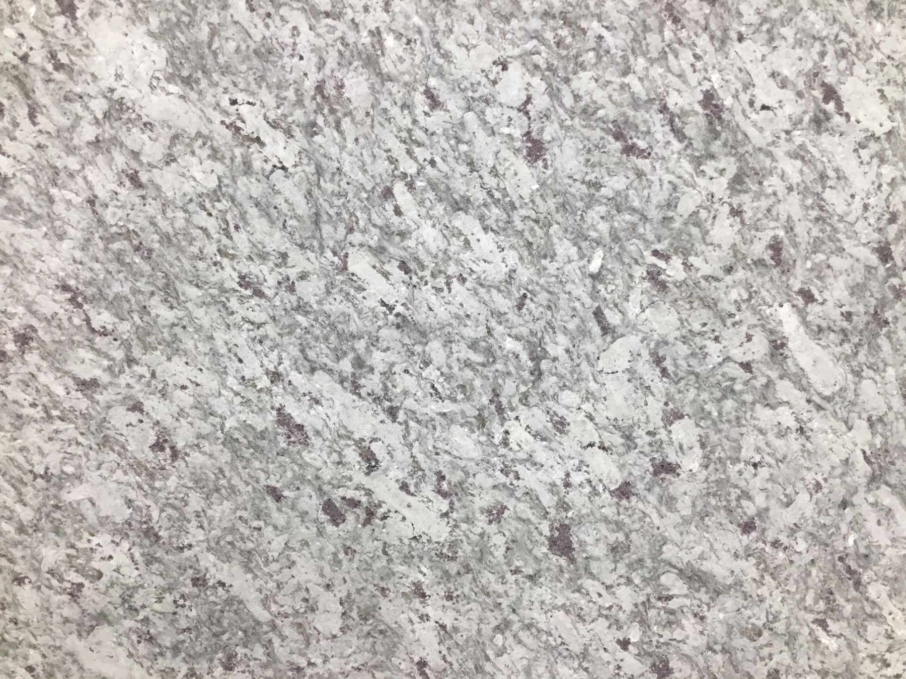 Gray and white granite-like surface with dark flecks.