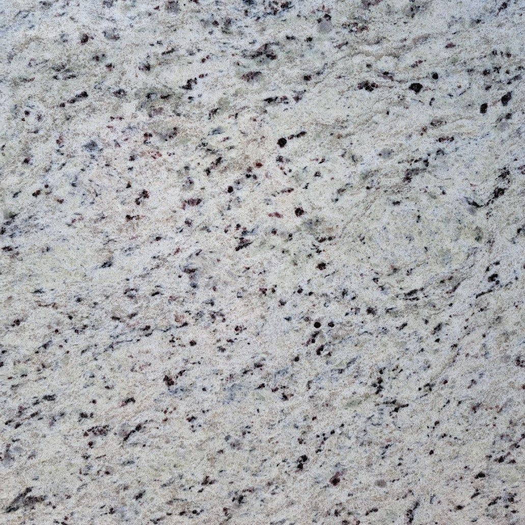 White granite countertop with black and gray speckles.
