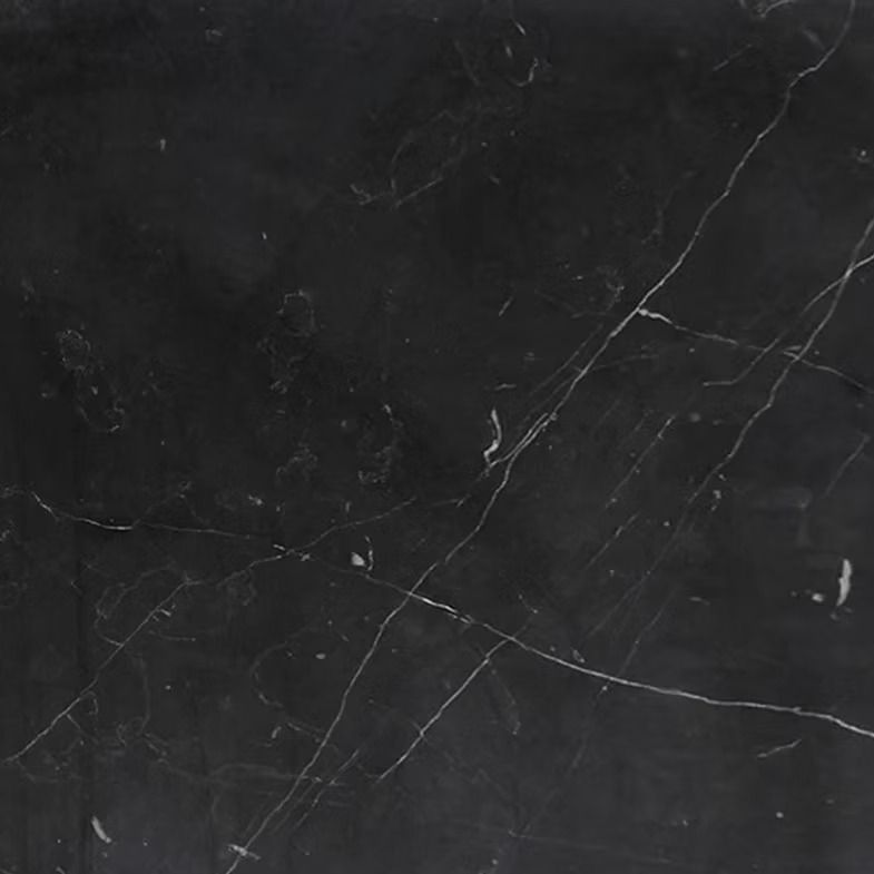 Black marble tile with white veining.