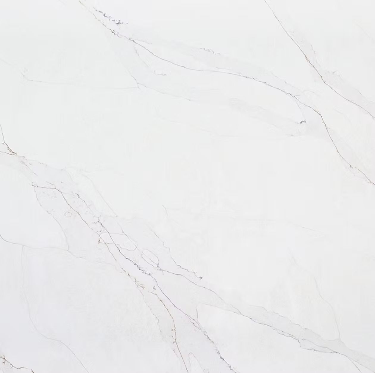 White marble countertop with subtle gray and gold veining.