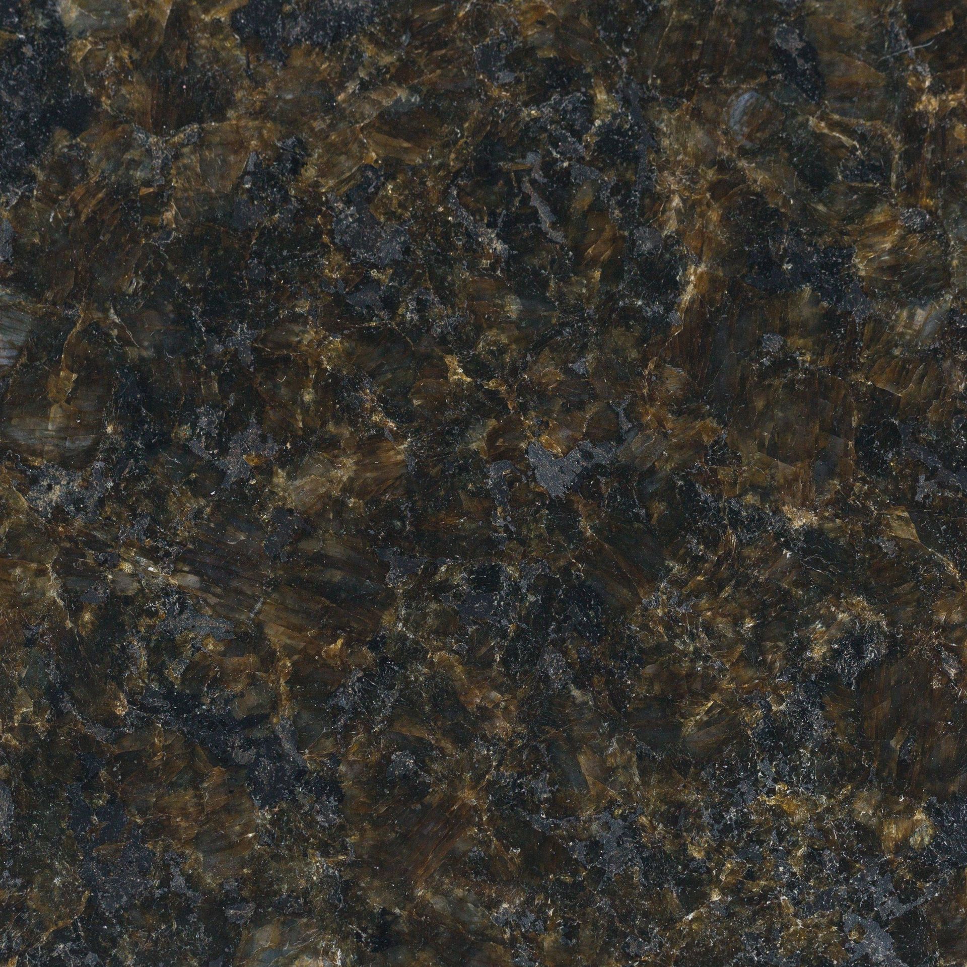 Dark granite countertop with brown and gray flecks.