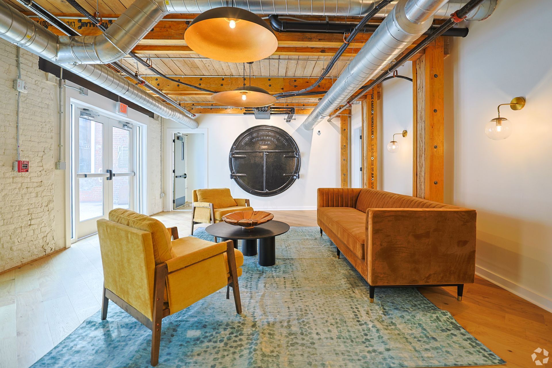 A couch with a pillow on it is sitting next to a table.