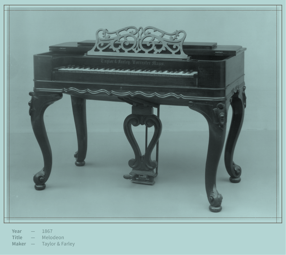 A black and white photo of an antique piano