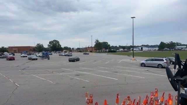 A lot of cars are parked in a parking lot.