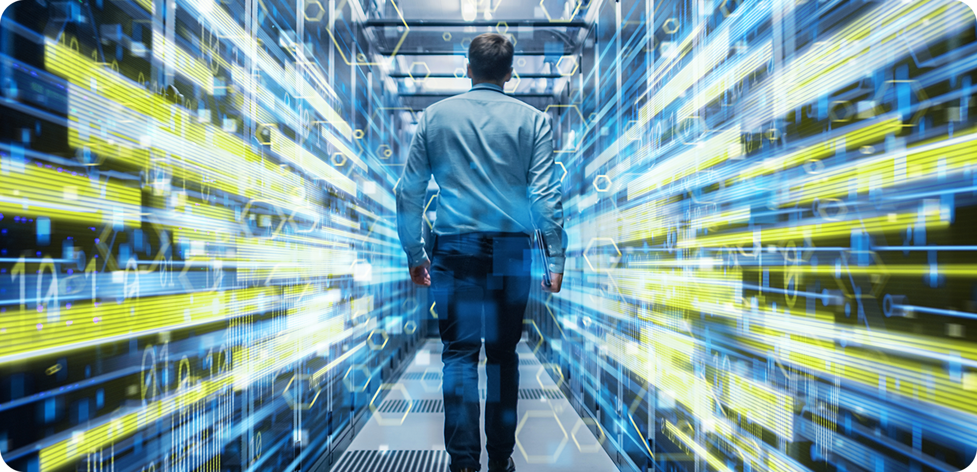 A man walks through a server room with digital data streams on either side.