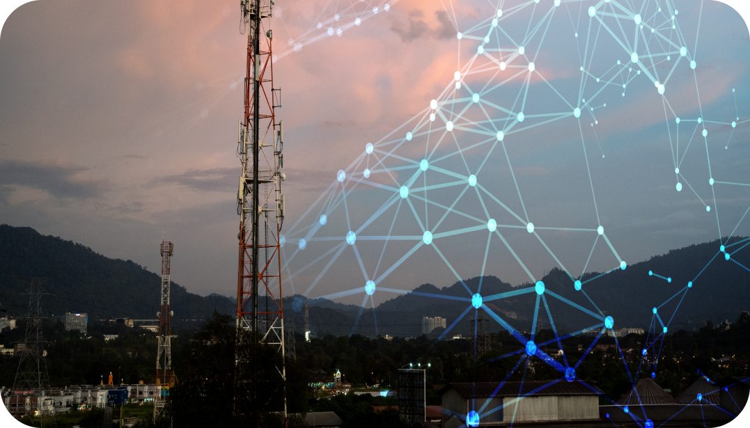 Cell tower in a landscape with a superimposed network graphic; dusk sky, mountains.