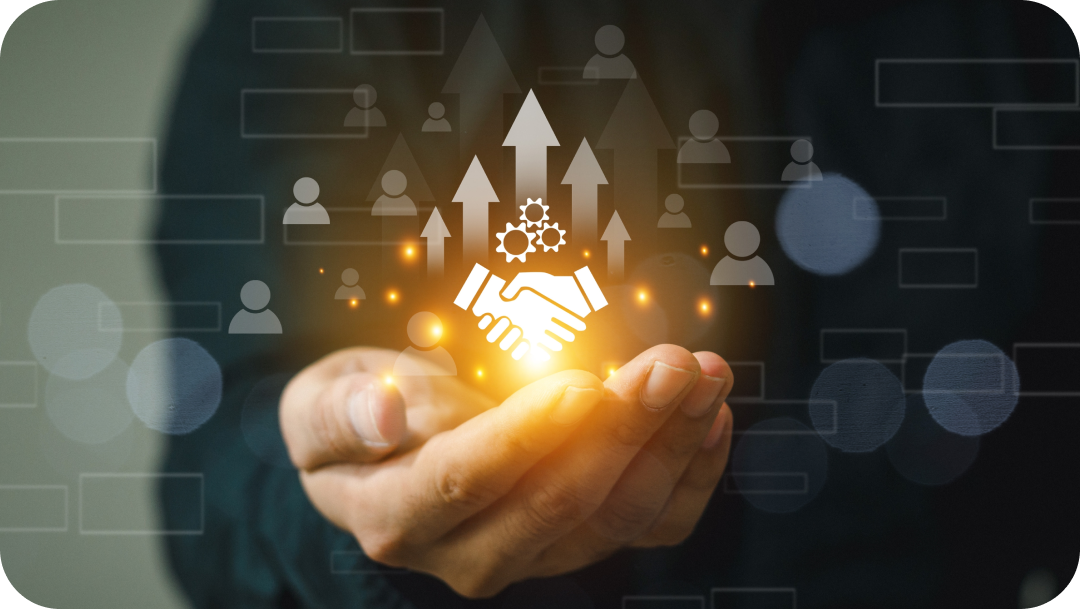 Hands holding a glowing image of a handshake with upward arrows, gears, and people icons.