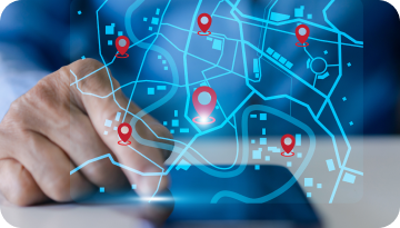 Hand interacting with a digital map displaying red location pins on a blue grid, representing navigation or tracking.