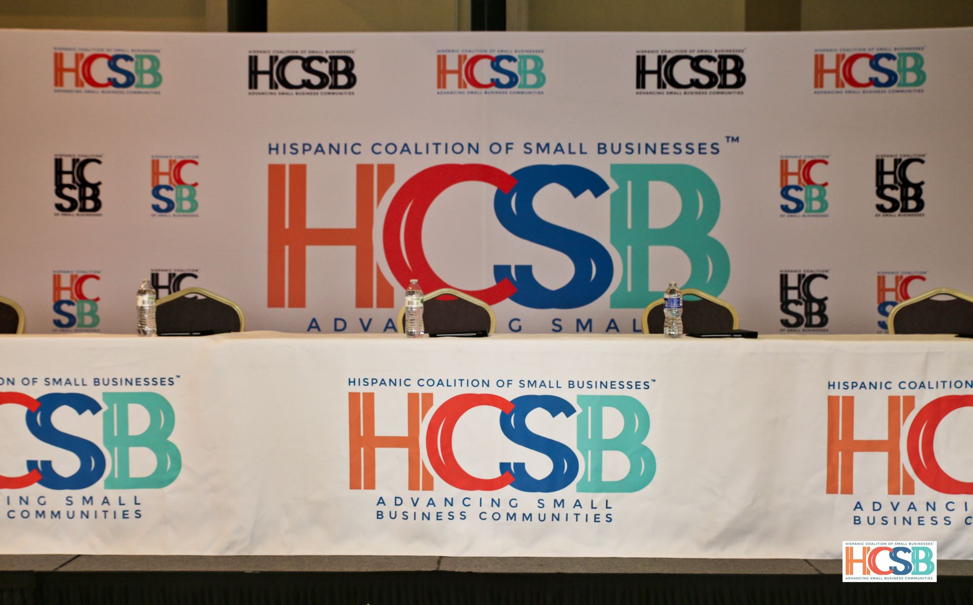 A table with a banner that says hispanic coalition of small businesses