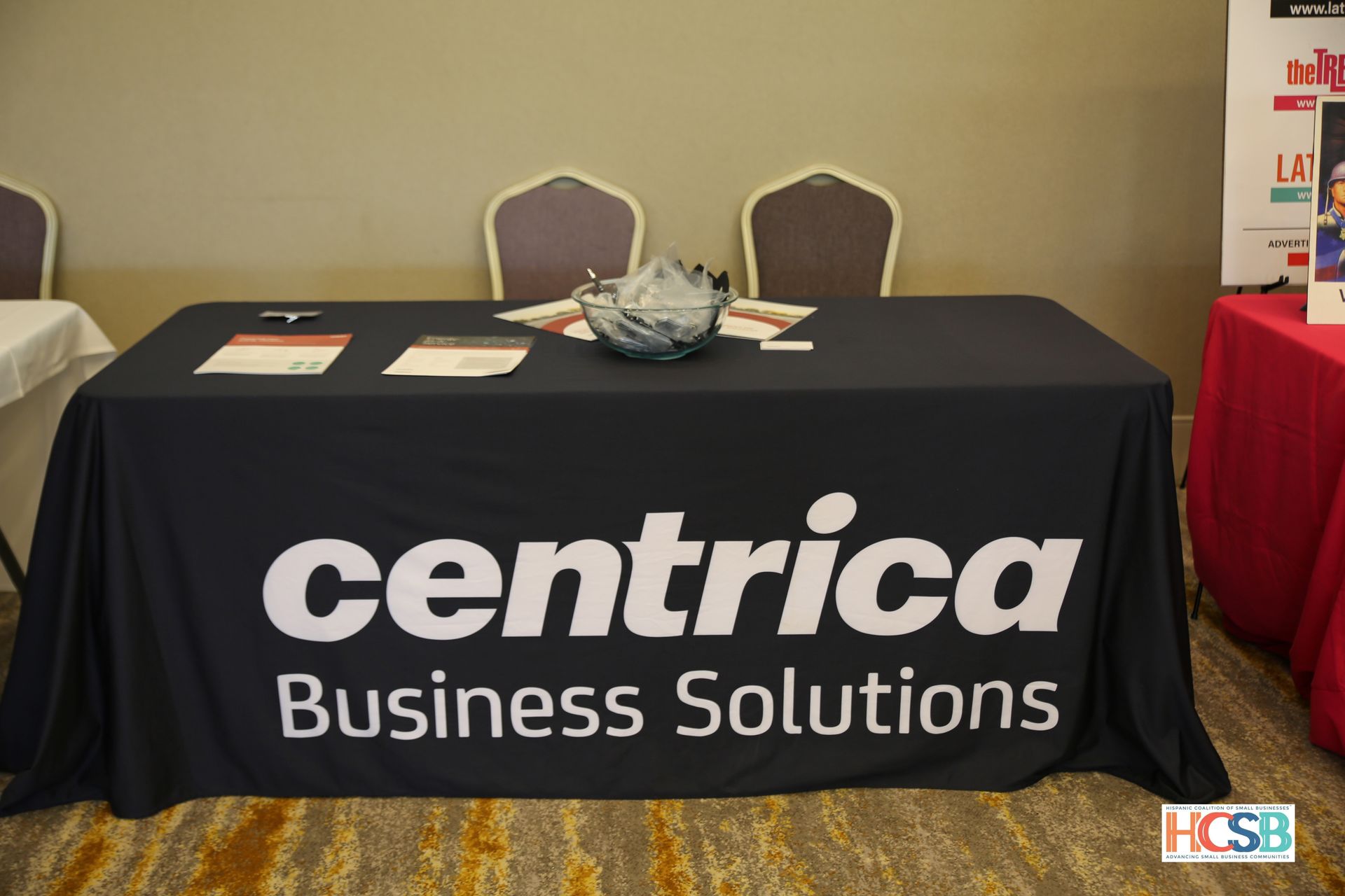 A table with a black table cloth that says centra business solutions