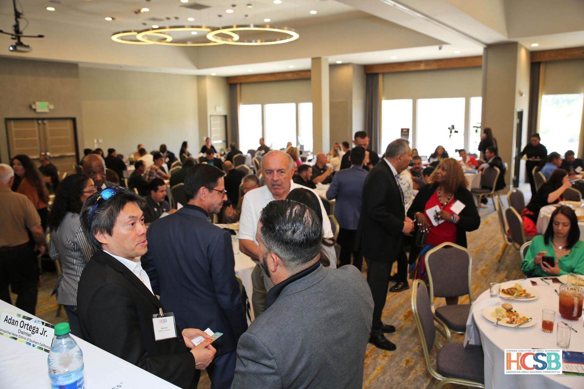 A large group of people are gathered in a large room