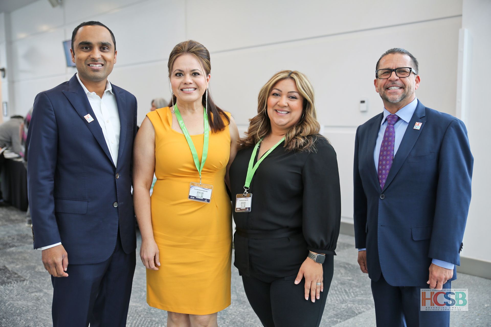 A group of people in suits and ties are posing for a picture.