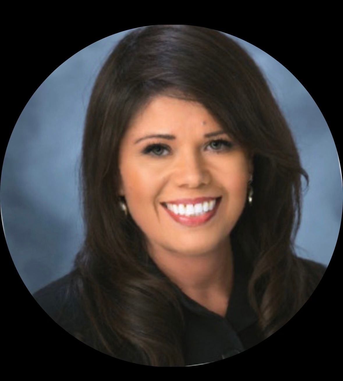 A woman is smiling in a circle with a blue background