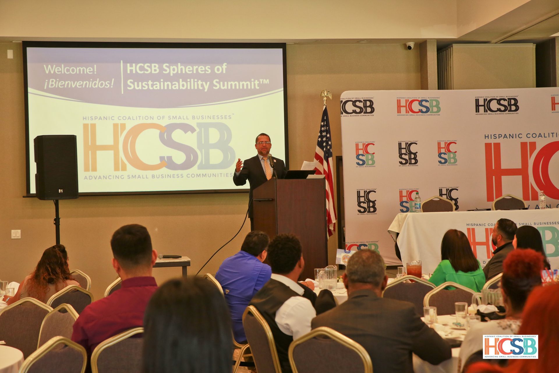 A man is giving a presentation to a group of people at a conference.