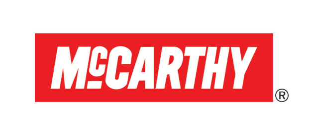 A red and white mccarthy logo on a white background