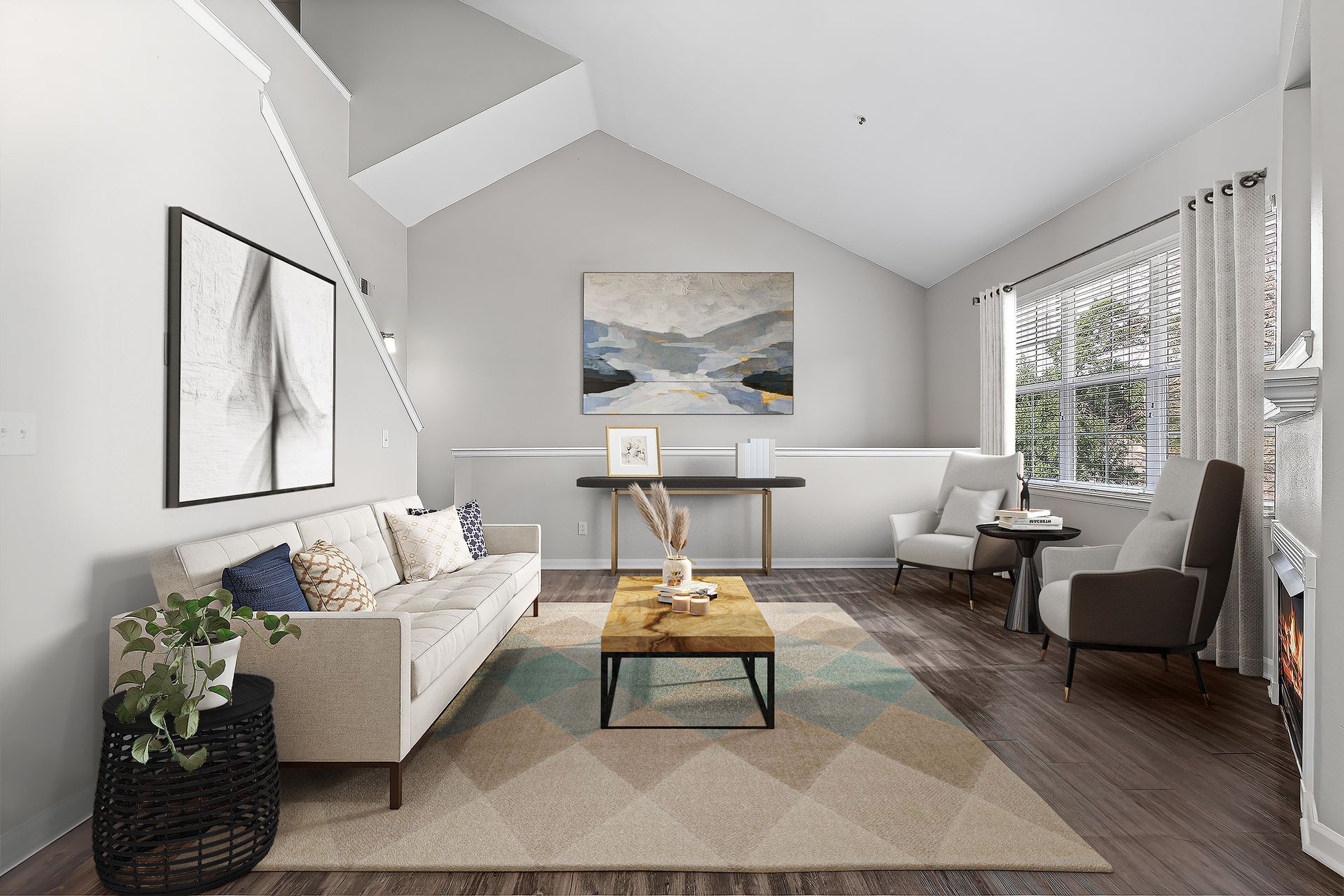 Bright living room with a beige sofa, two chairs, a coffee table, and a large window.