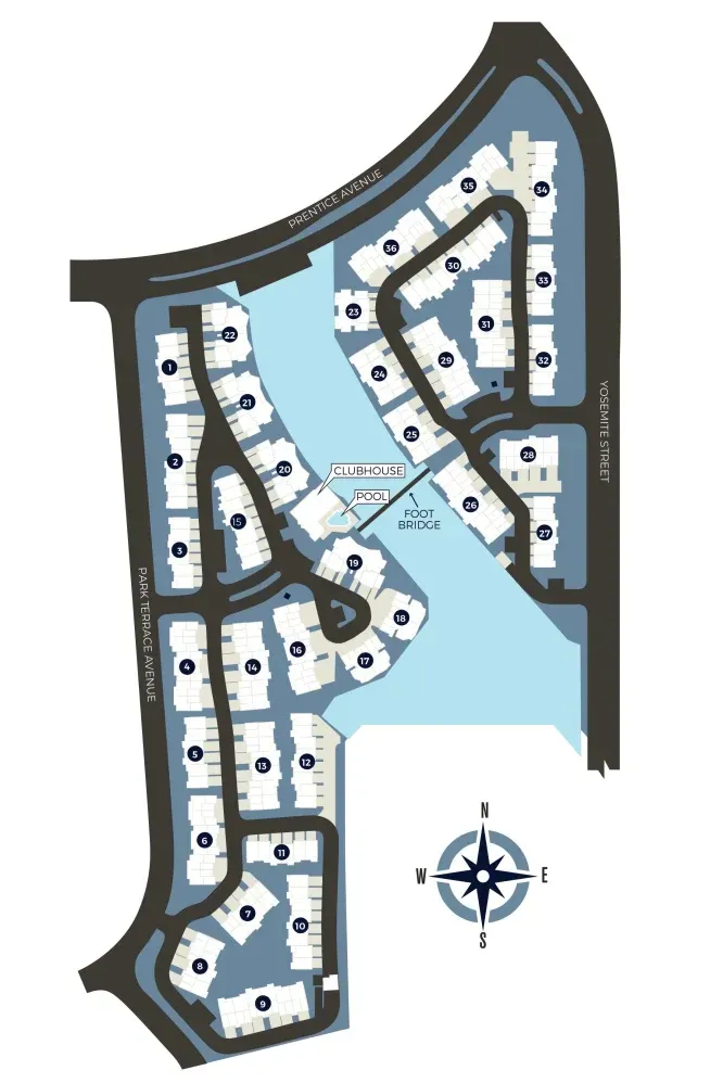 Map of a waterfront community with numbered buildings and roads. Includes a compass rose.