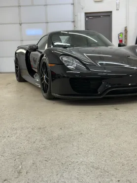Black Sports Car with Window tint and coat. 