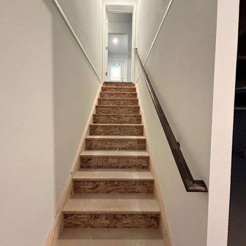 A set of stairs leading up to the second floor of a house.