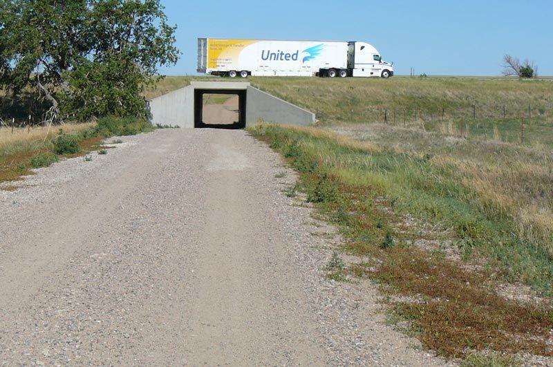 A united truck is driving down a dirt road