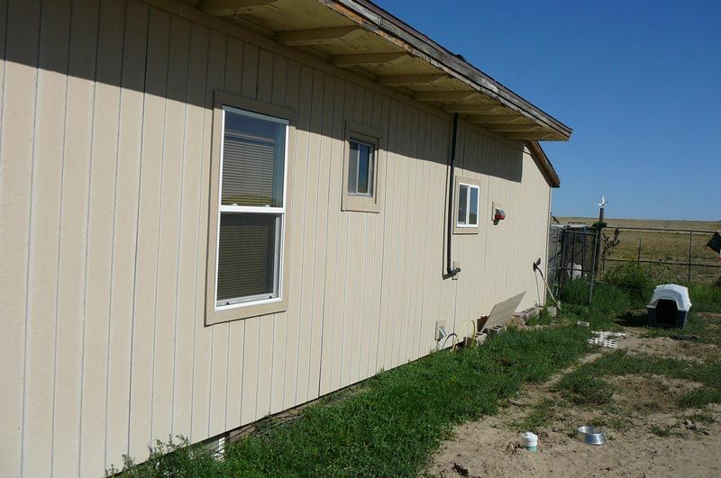 A house with a lot of windows on the side of it