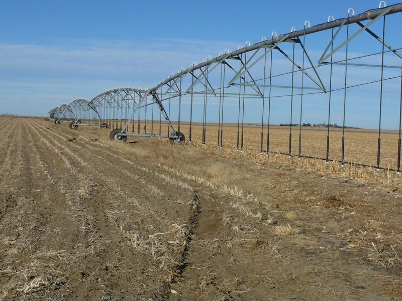 A row of irrigation pipes in a field